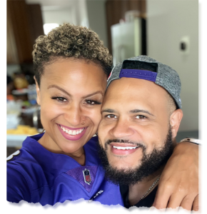 Angela and David Harper smiling together, exuding confidence and professionalism, ready to guide others toward financial empowerment.