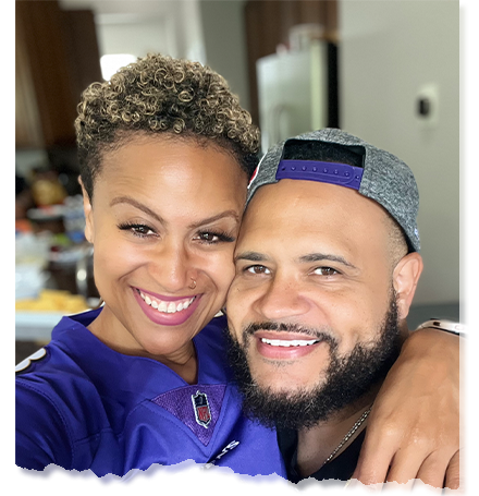 Angela and David Harper smiling together, exuding confidence and professionalism, ready to guide others toward financial empowerment.